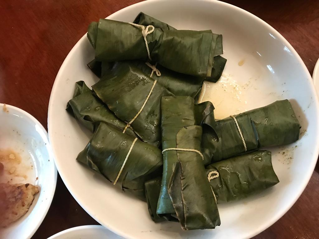 Steamed Patra ni Macchi in banana leaf parcels