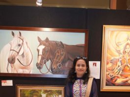 Arupa with her Artworks at Exhibition
