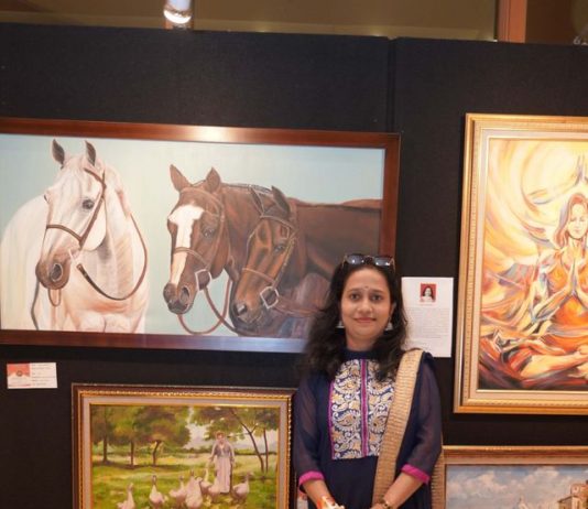 Arupa with her Artworks at Exhibition