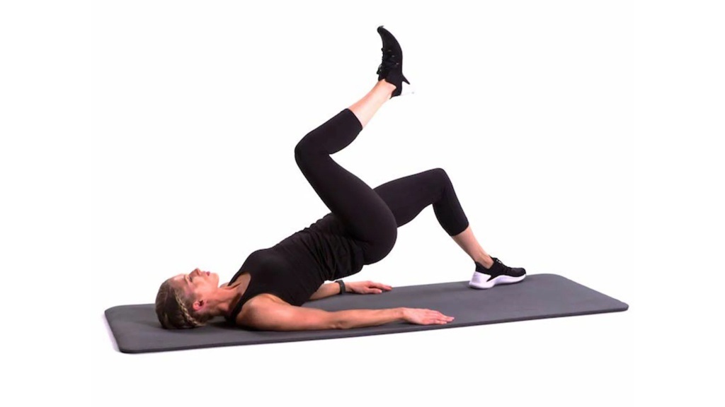 5-Minute Exercises in Bed to Treat Tense Muscles: Hip Bridge With Leg March