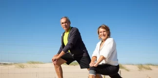 happy-elderly-couple-doing-workout-together