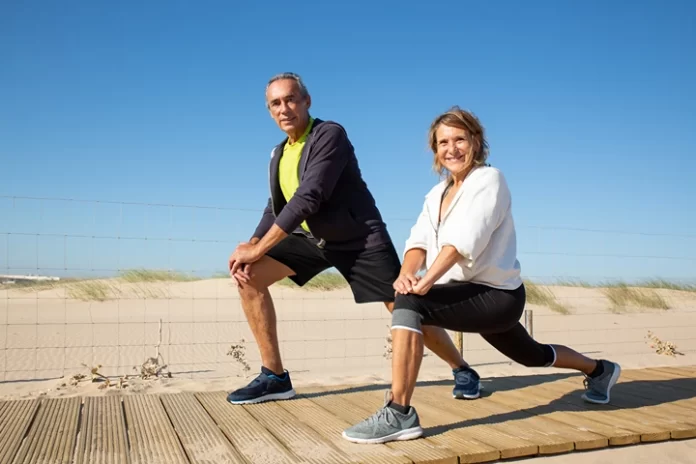 happy-elderly-couple-doing-workout-together