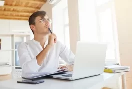 A Man is Thinking in Front of Laptop