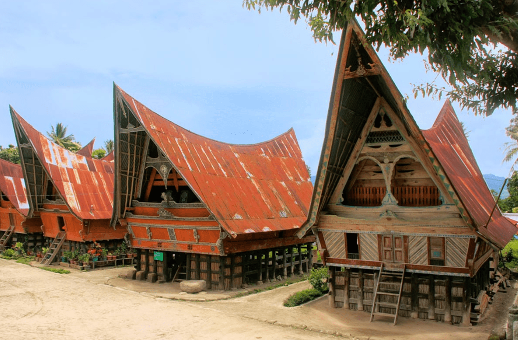 Ambarita where elegant Batak houses provide a beautiful setting for the megalithic stone table and chairs of the historical court of justice.