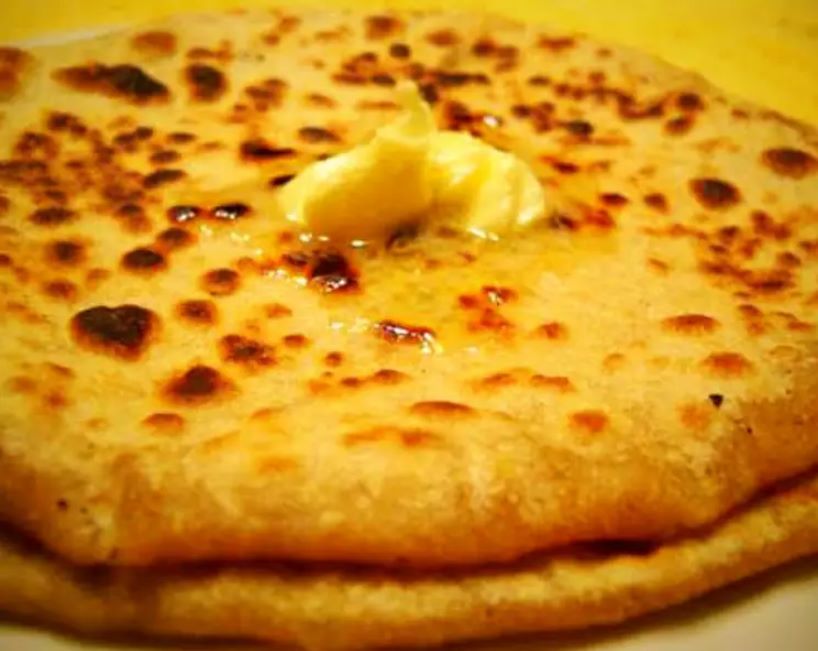 Aloo Paratha with a dollop of butter